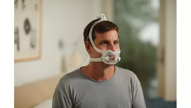 Face mask with a nose and mouth cushion